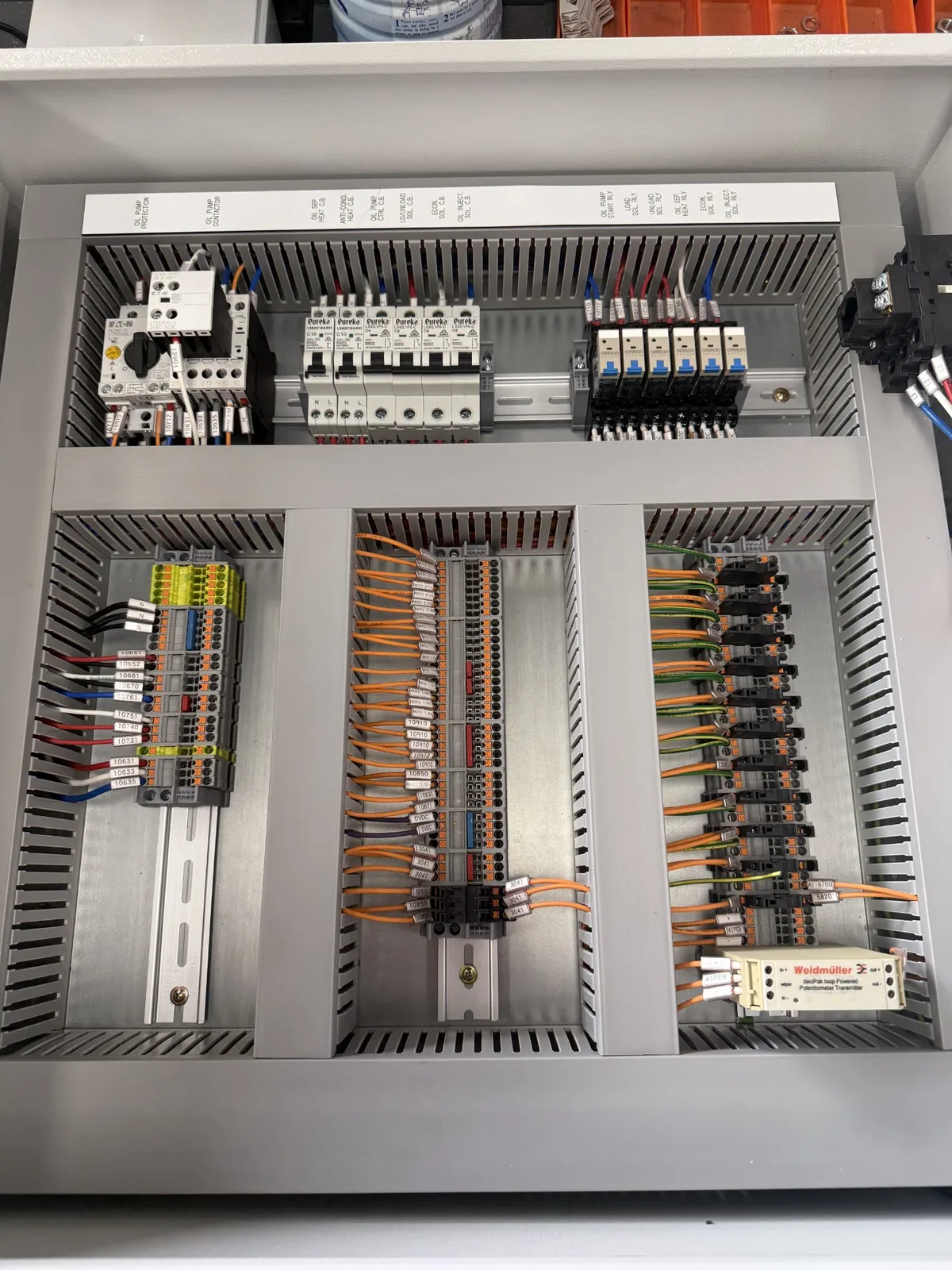 Custom switchboard build with labelled circuit breakers and terminals